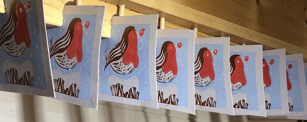 shaun forward festive robin lino print greetings cards drying